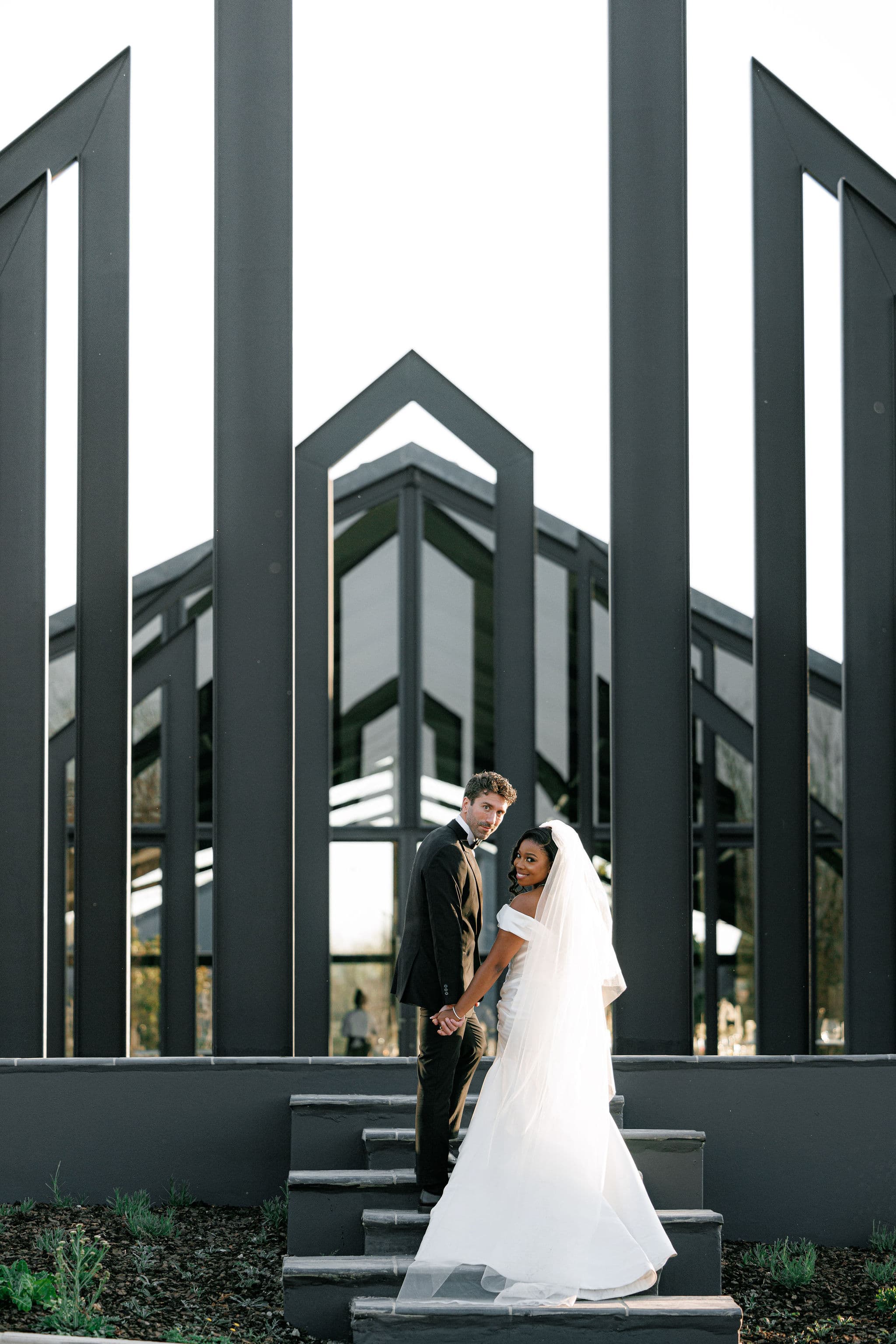 A couple on the glass chapel steps