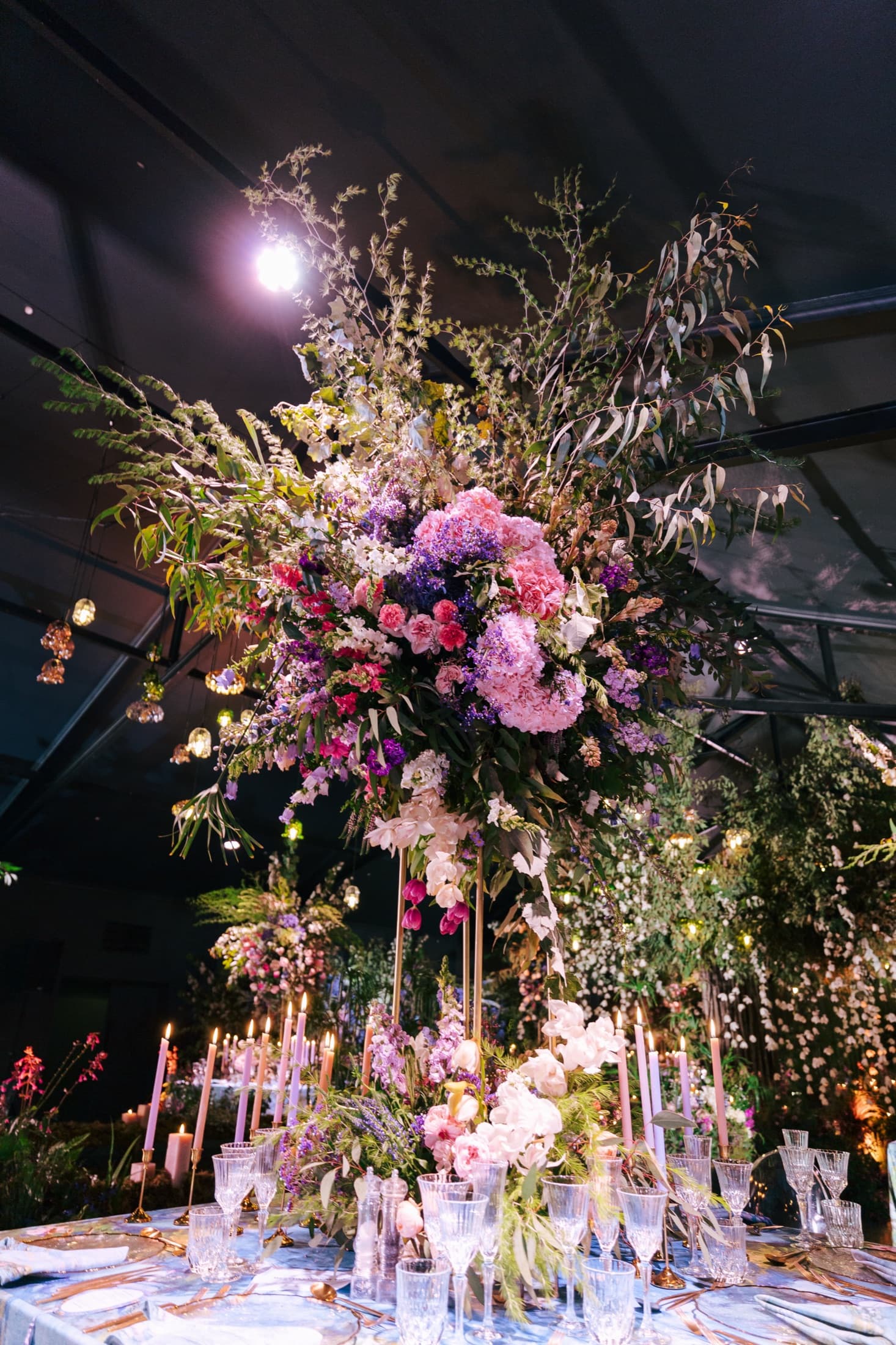 Extravagant florals under the glass marquee at Inimitable