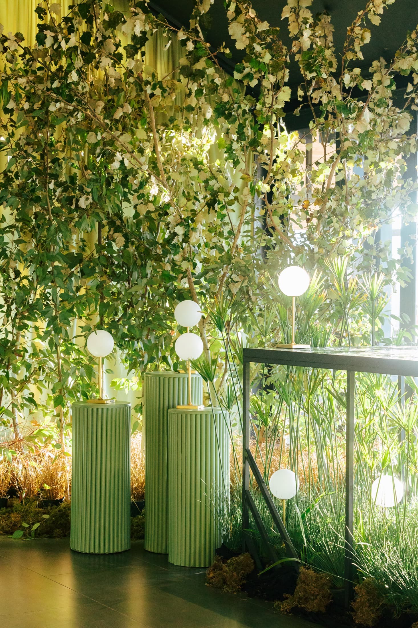 Greenery and glass inside the marquee at Inimitable
